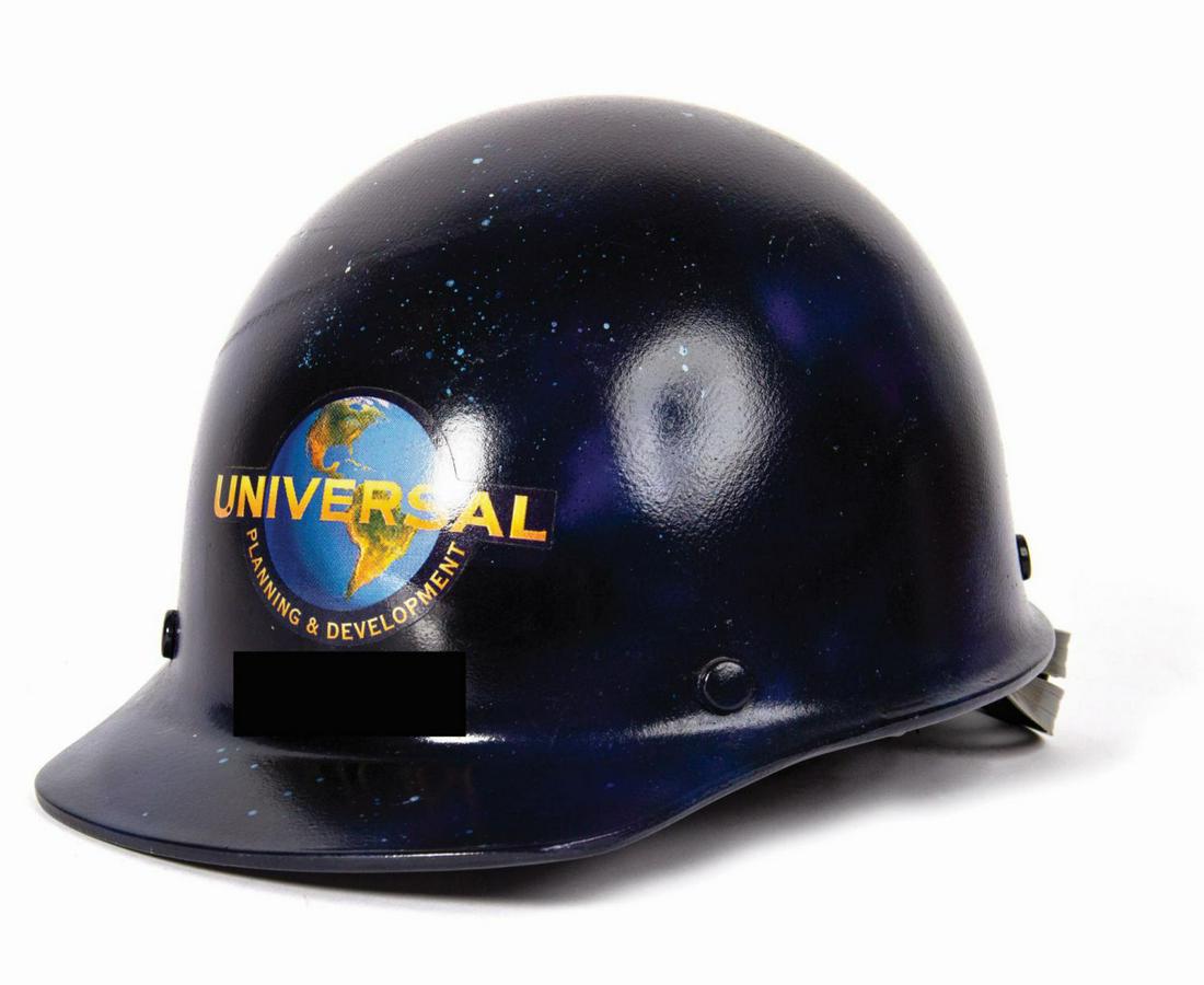 Universal Studios Jurassic Park: The Ride Hard Hat.: (Universal, c.1995) An extremely rare hard hat specially created for the Universal Planning & Development team. This particular hard hat was used by a team member working on Jurassic Park: The Ride, a