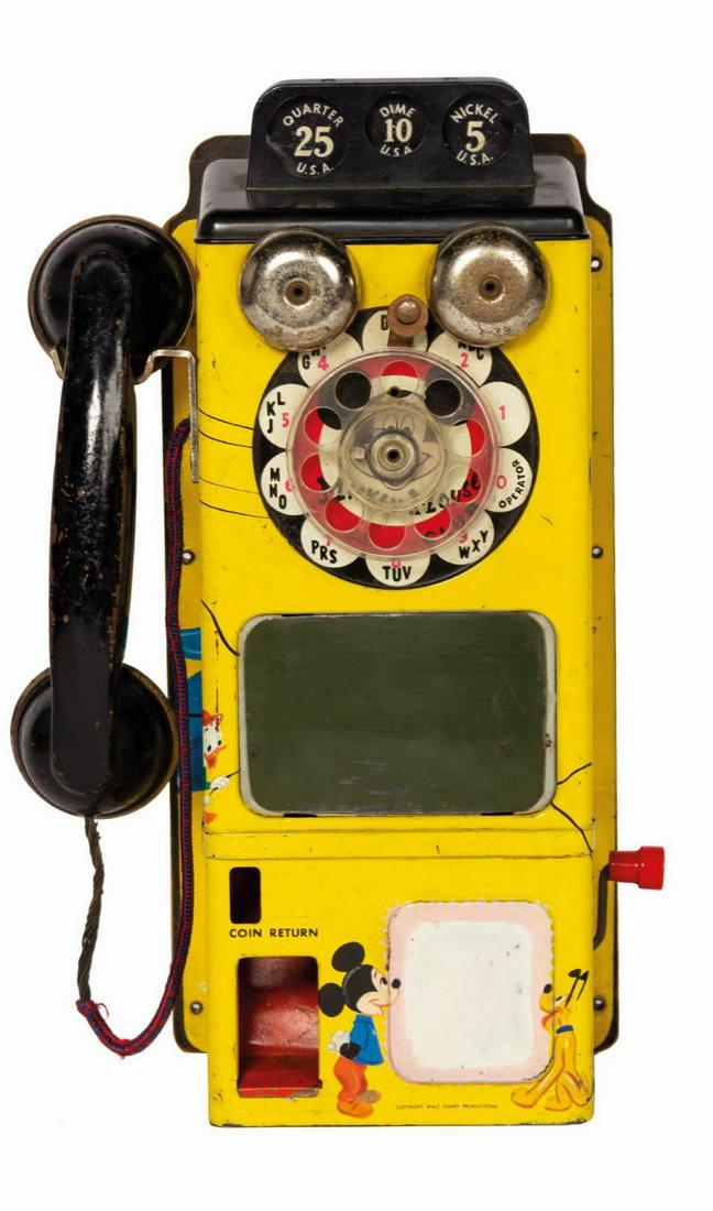 Mickey Mouse Club TV Pay Phone Tin Toy.: (Gong Bell, c.1950s) A vintage tin lithographic Mickey Mouse Club TV Pay Phone. The payphone box features coin slots and a coin return, a rotary dial, a pair of bells, a telephone handset with string