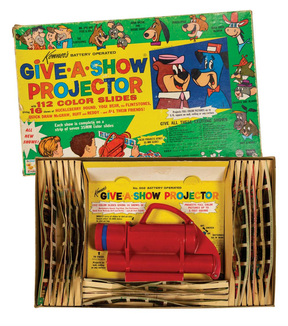 Give-a-Show Projector Set with Slides.: (Kenner, 1962) A very rare boxed slide projector set by Kenner, featuring iconic Hanna-Barbera characters such as Yogi Bear, Huckleberry Hound, The Flintstones, and more. The set includes the original