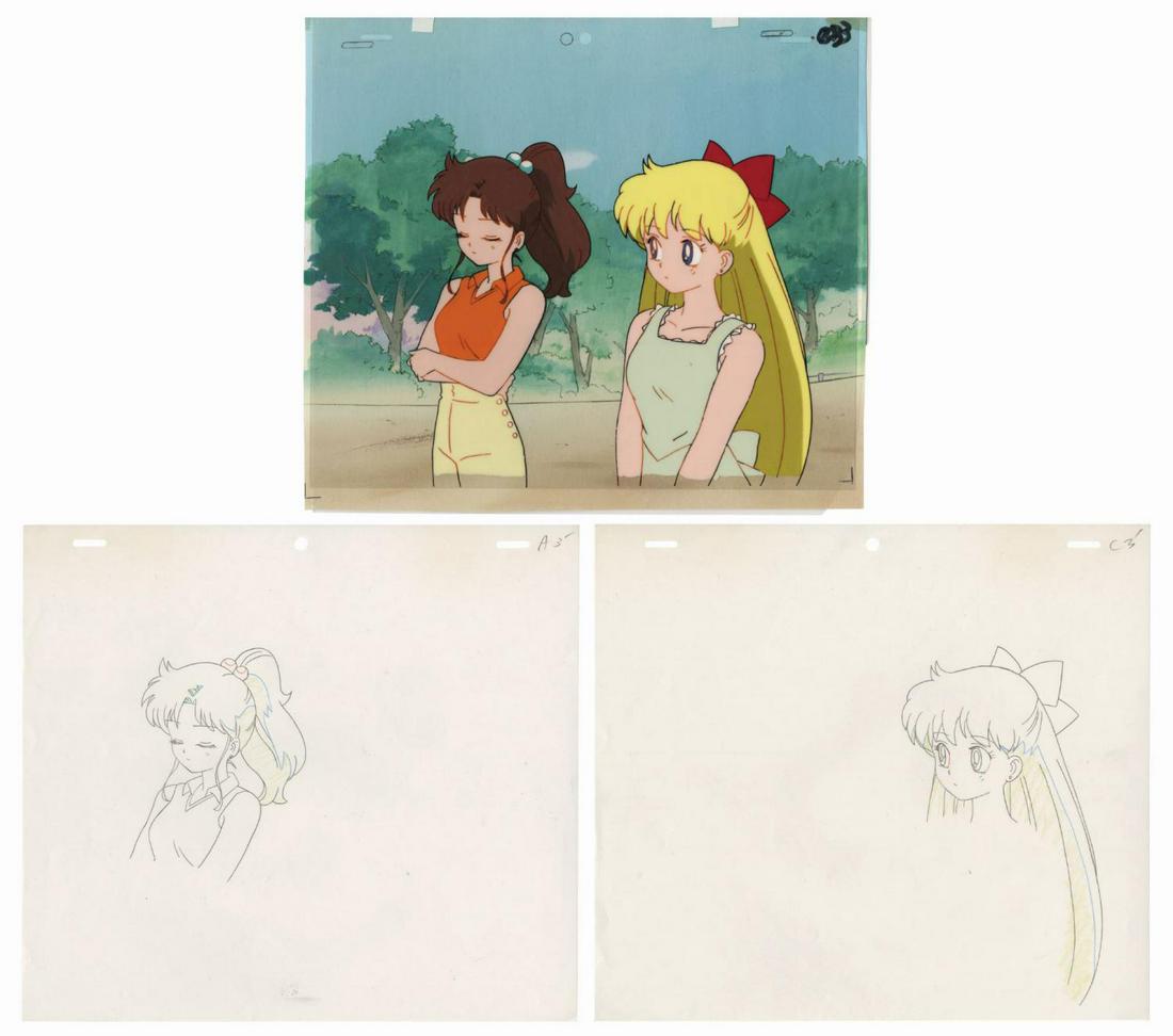 Original Sailor Moon Jupiter & Venus Cel & Background.: (Toei, 1992) An original production cel and background from Sailor Moon. The cel features Makoto Kino (Sailor Jupiter) and Minako Aino (Sailor Venus) on two separate cel layers, which are placed over 