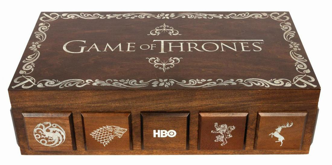 Game of Thrones Promotional Chest.: (HBO, 2013) A custom wooden chest created to promote Season 3 of the HBO’s fantasy epic, Game of Thrones. The top of the lid is laser etched with the series title logo and foliate border design. Woo