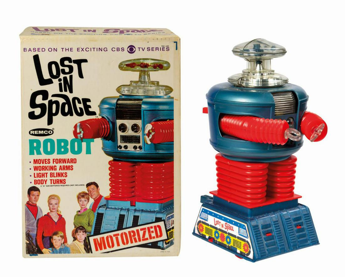 Lost in Space Motorized Robot.: (Remco, 1966) A vintage Lost in Space Motorized Robot manufactured by Remco. When batteries are inserted, a light in the Robot's chest illuminates as wheels in the base roll forward. The arms move via