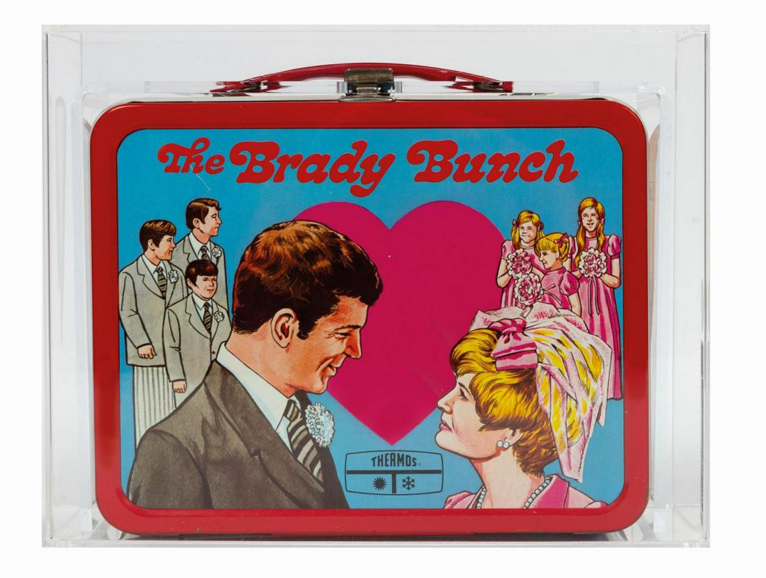 The Brady Bunch Lunch Box.: (King-Seeely, 1970) A vintage The Brady Bunch tin lithographic lunch box manufactured by King-Seeley. It has been encapsulated in a protective acrylic display case by Collector Archive Services, which