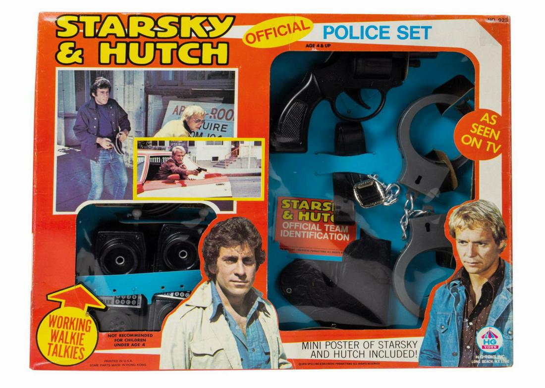 Starsky & Hutch Police Set.: (HG Toys, 1976) A vintage Starsky & Hutch Police Set manufactured by HG Toys. The set includes a plastic .45 revolver, a vinyl shoulder holster and strap, plastic handcuffs, plastic handcuff keys, a p