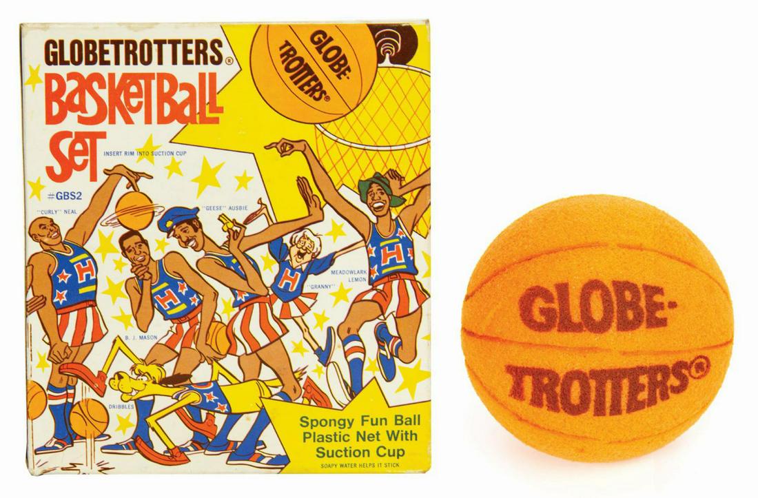 Globetrotters Basketball Set.: (Brooklyn Products, 1971) A vintage Harlem Globetrotters Basketball Set. It consists of a plastic hoop with plastic net, a black rubber suction cup for mounting the hoop, and an orange foam ball with 
