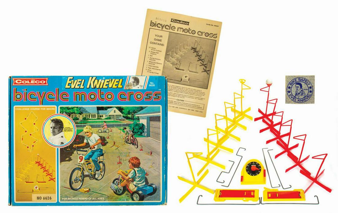 Evel Knievel Bicycle Moto Cross.: (Coleco, 1970) A vintage Evel Knievel Bicycle Moto Cross playset manufactured by Coleco. The complete set comes in the original clamshell-style cardboard box packaging with form fitted cardboard inser