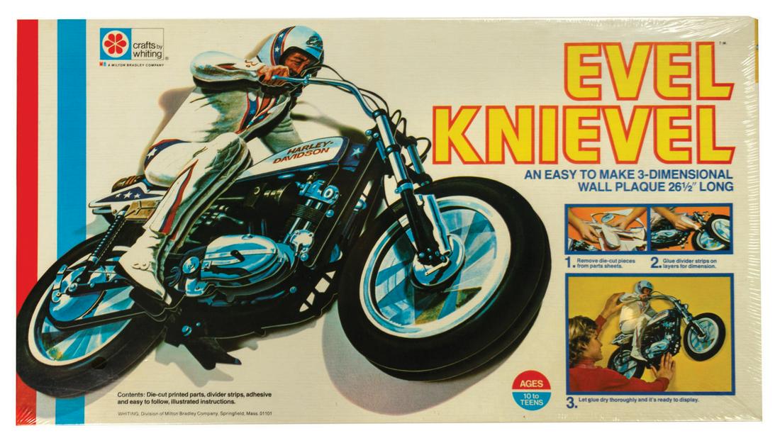Evel Knievel 3-D Wall Plaque.: (Milton Bradley, 1975) A vintage Evel Knievel 3-dimmensional wall plaque kit manufactured by Milton Bradley. The kit consists of diecut printed parts sheets, divider strips, adhesive, and illustrated