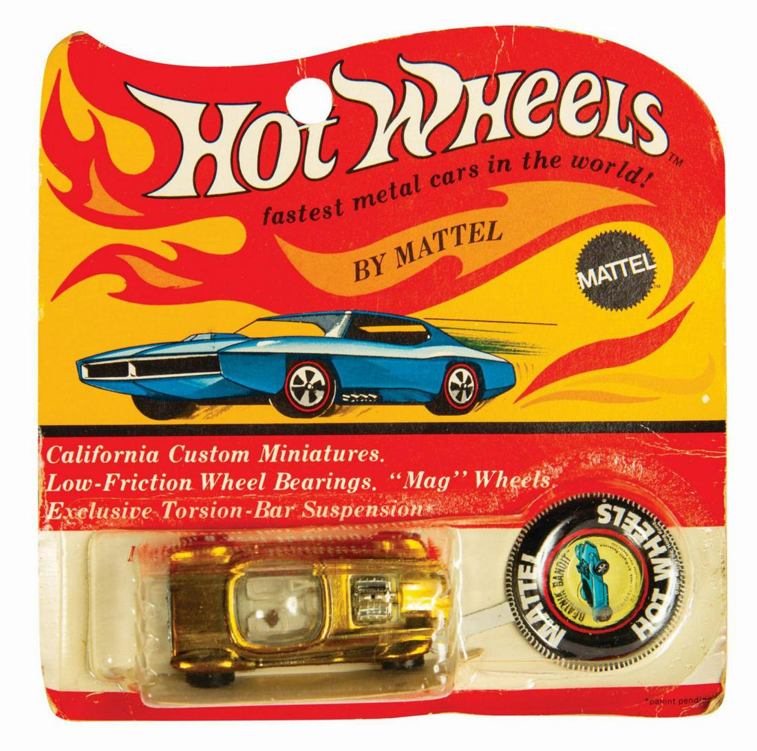 Signed Hot Wheels Gold Beatnik Bandit on Card.: (Mattel, 1969) A very rare gold colored Beatnik Bandit die-cast car by Hot Wheels. This hotrod design was created in 1961 by legendary car customizer and visual artist, Ed "Big Daddy" Roth, with this 