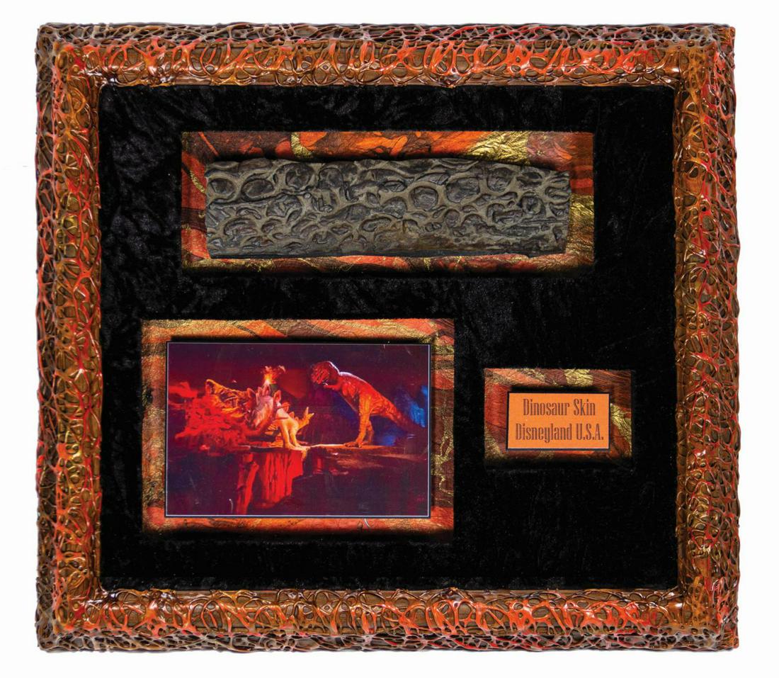 Primeval World Dinosaur Skin Prop.: (Disneyland, c.1990s) An original dinosaur skin prop from the Primeval World diorama at Disneyland. Encased in a custom frame, this ride prop is in the style seen by Disneyland Railroad guests in the 