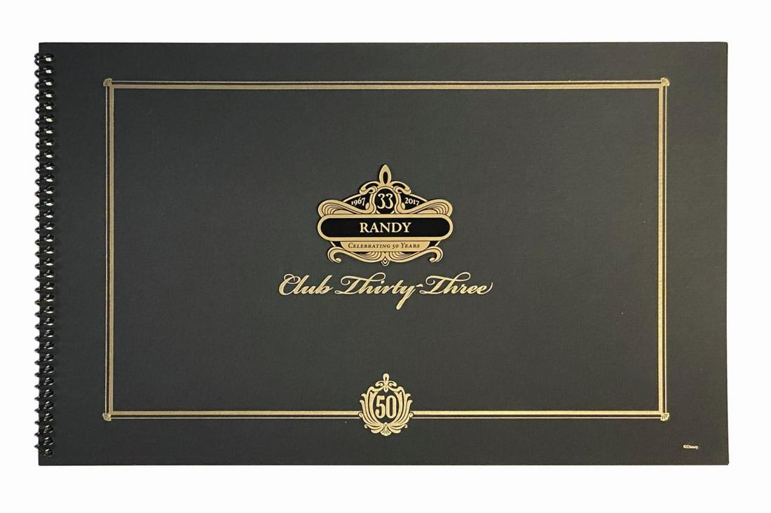 Club 33 50th Anniversary Cast Member Book.: (Disneyland, 2017) A Club 33 50th anniversary book created exclusively for cast members. The cover of the spiral bound book is personalized to "Randy" with an applied ornately designed molded plastic