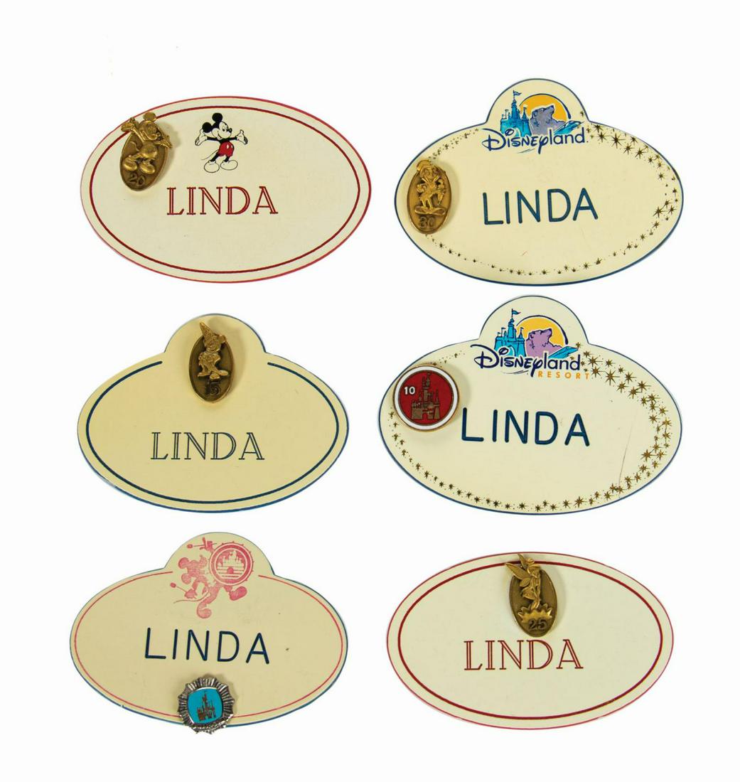 Set of (18) "Linda" Cast Member Nametags.: (Disneyland, c.1970s-2000s) A collection of (18) Disneyland cast member name tags from various years. The pins all bear the name "Linda" and feature the logos from various Disneyland events, including