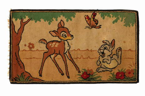 Bambi Tapestry Rug.: (Disney, 1942) A vintage woven tapestry rug depicting Bambi, Thumper, and a butterfly in a woodland setting. Measuring 21.25"x37.25", the piece is in good condition with darkening to the cream