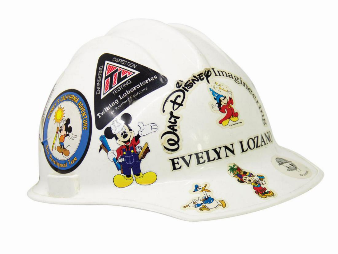 WDI Infrastructure Team White Hard Hat.: (WDI, c.2000) A Walt Disney Imagineering Infrastructure team personalized safety hard hat manufactured by Bullard. The white hard plastic hat features WDI and Sorcerer Mickey decals on the front of th