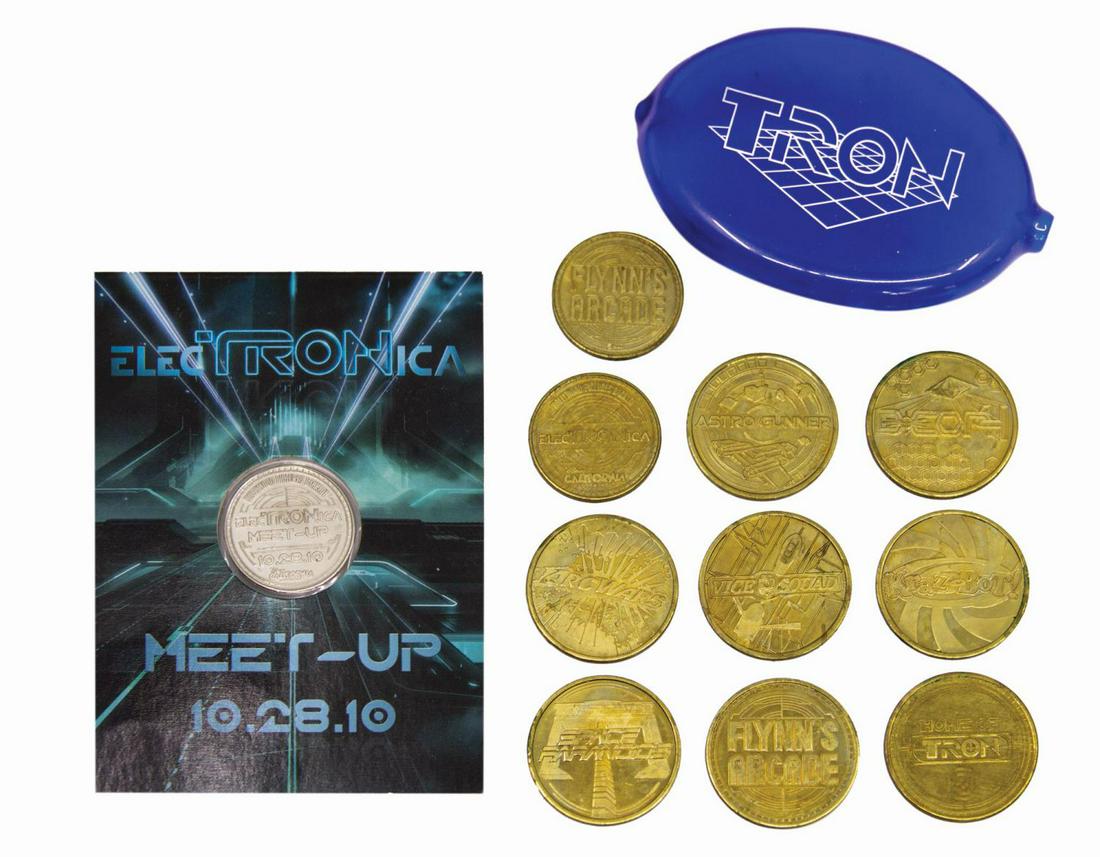 ElecTRONica Flynn's Arcade Tokens & Token Pouch.: (California Adventure, 2010) A very rare set of (9) Flynn's Arcade tokens, token pouch, and carded token from the ElecTRONica meet-up on October 28, 2010, in celebration of the release of TRON: Legacy