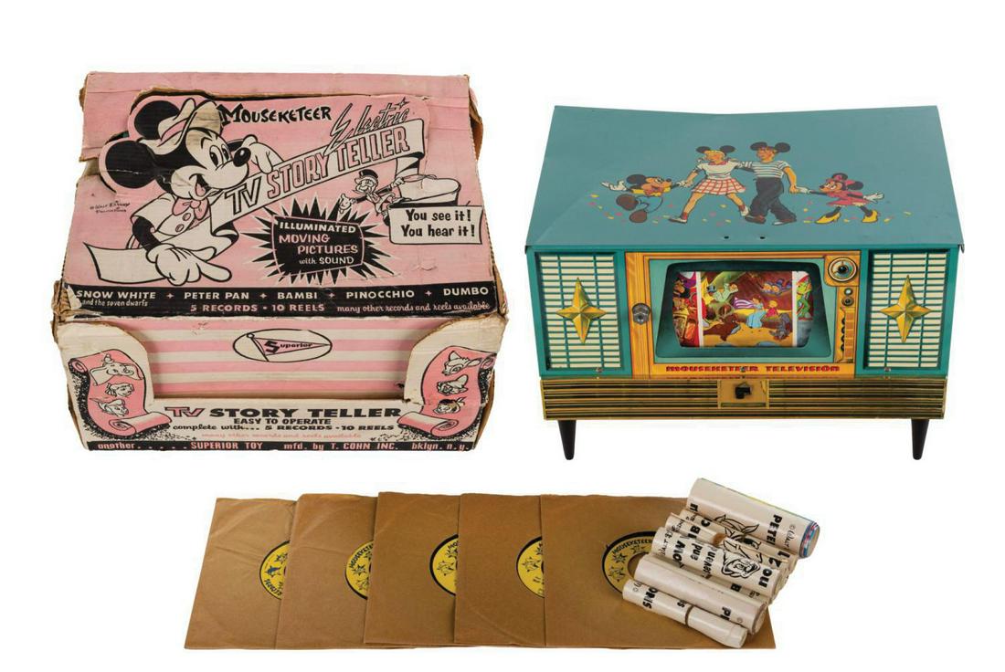 Mouseketeer Electric TV Story Teller Toy.: (Disney, c.1955) A Mouseketeer Electric TV Story Teller toy by Superior. The electric phonograph features illuminated moving pictures with sound, (5) records, and (10) picture reels in the original bo