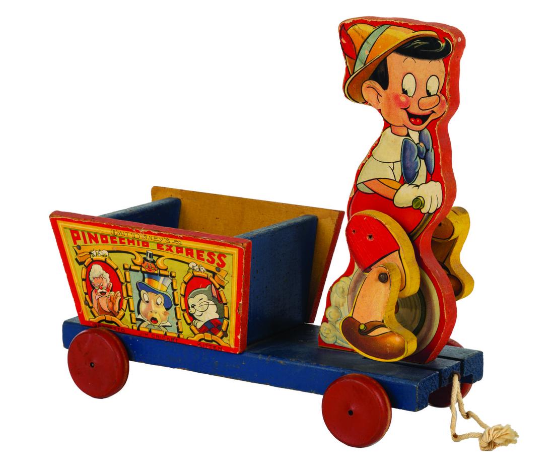 Pinocchio Express Pull Toy Fisher Price: (Fisher-Price, 1939) A Walt Disney's Pinocchio Express Toy by Fisher Price. The jointed motion toy functions despite a missing original pull string. Measuring 10.25" tall and 11"x4.75", the toy displa