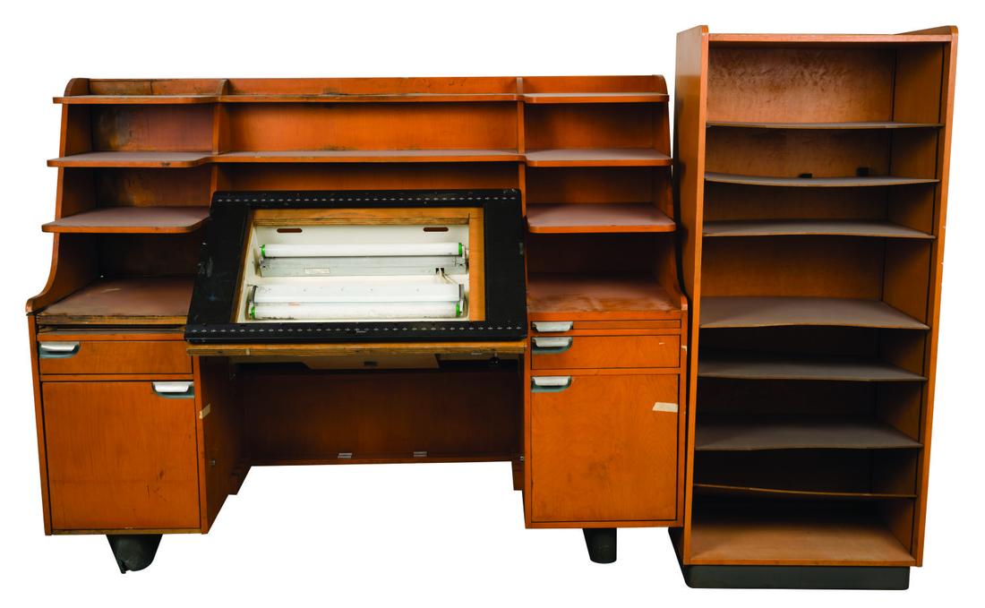 A Disney Studio Kem Weber Inspired Lead Animator's Desk: A rare Walt Disney Studio-used "Kem Weber-like" Animator's desk from the Disney Feature Animation Studio in Orlando. This style desk was used by lead animators and seen in use by the artists in the An