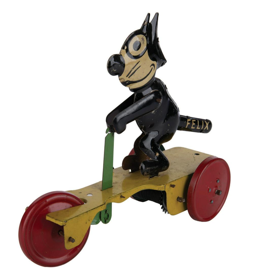 A Felix the Cat Wind-Up Tin Toy Scooter. (1 of 2)