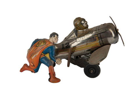 A Superman Rollover Plane Wind-Up Tin Toy.: (Marx, 1940) A tin litho wind-up Superman and plane toy. The toy was designed to roll forward with Superman periodically flipping over to move it in a new direction. Measuring 5.5"x6" this plane displ