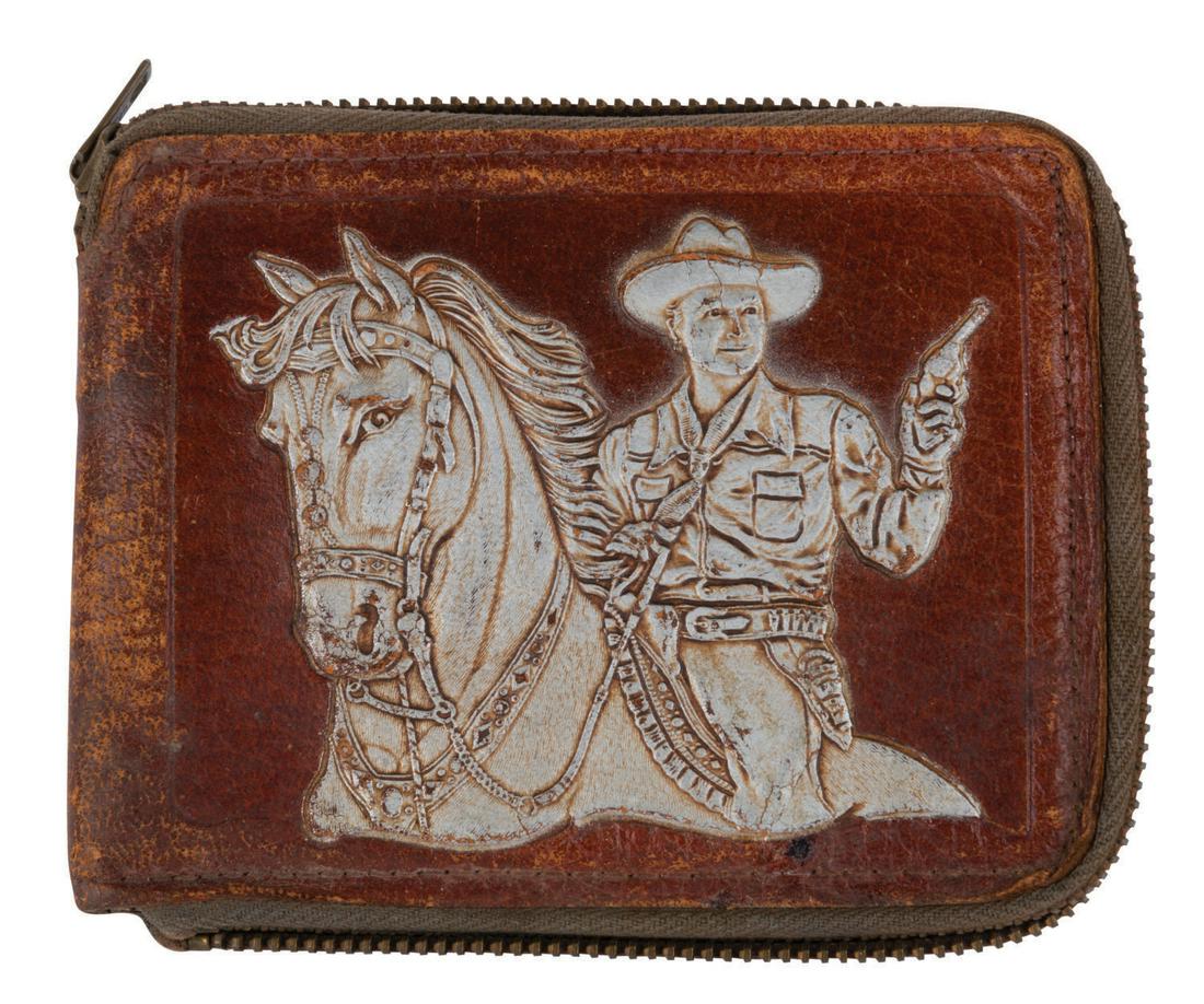 A Top Secret Hopalong Cassidy Leather Wallet.: (Top Secret, 1950s) A Hopalong Cassidy leather wallet featuring an embossed image of Hopalong on his horse on one side and his name on the other. The interior features a Hopalong Cassidy "Special Agen