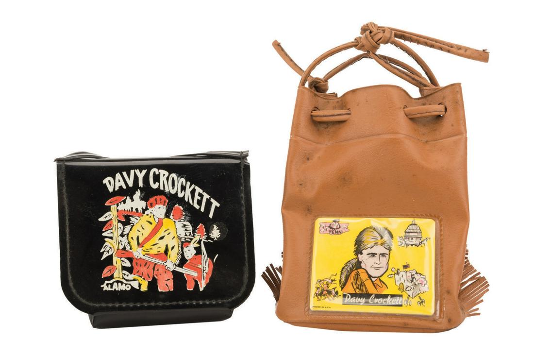 A Pair of Davy Crockett Child's Purses.: (1950s) A pair of Davy Crockett Children's Purses by unknown manufacturers. The vinyl purses feature colorful images of Davy, one with a 27.5" strap, the other with drawstrings. Measuring 4.25"x3.75",