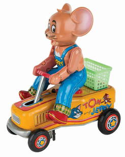 Tom & Jerry Battery-Operated Tin Toy.: (Modern Toys, 1960s) A Tin litho and vinyl battery operated toy hand car produced by Modern Toys in the 1960s. The toy features a colorful tin litho car with an attached Jerry with a tin litho body an