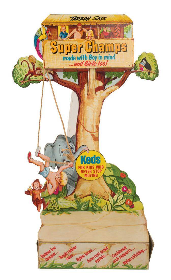 A Tarzan & Keds Super Champs Store Display by UniRoyal.: (UniRoyal, 1960s-70s) A Keds Super Champs Store Display by UniRoyal. The vintage heavy cardstock and twine display depicts Tarzan, Boy wearing a pair of Super Champ Juniors, and two girls in a tree ho