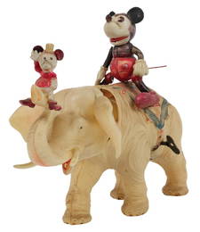 A Mickey & Minnie on Elephant Celluloid Wind-Up Toy.