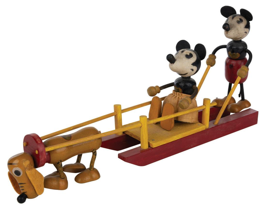 A Mickey, Minnie, and Pluto Dogsled Toy. (1 of 1)