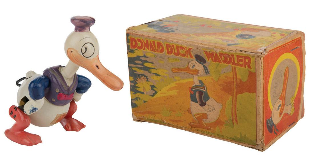 A "Donald Duck Waddler" Celluloid Wind-Up with Box. (1 of 4)