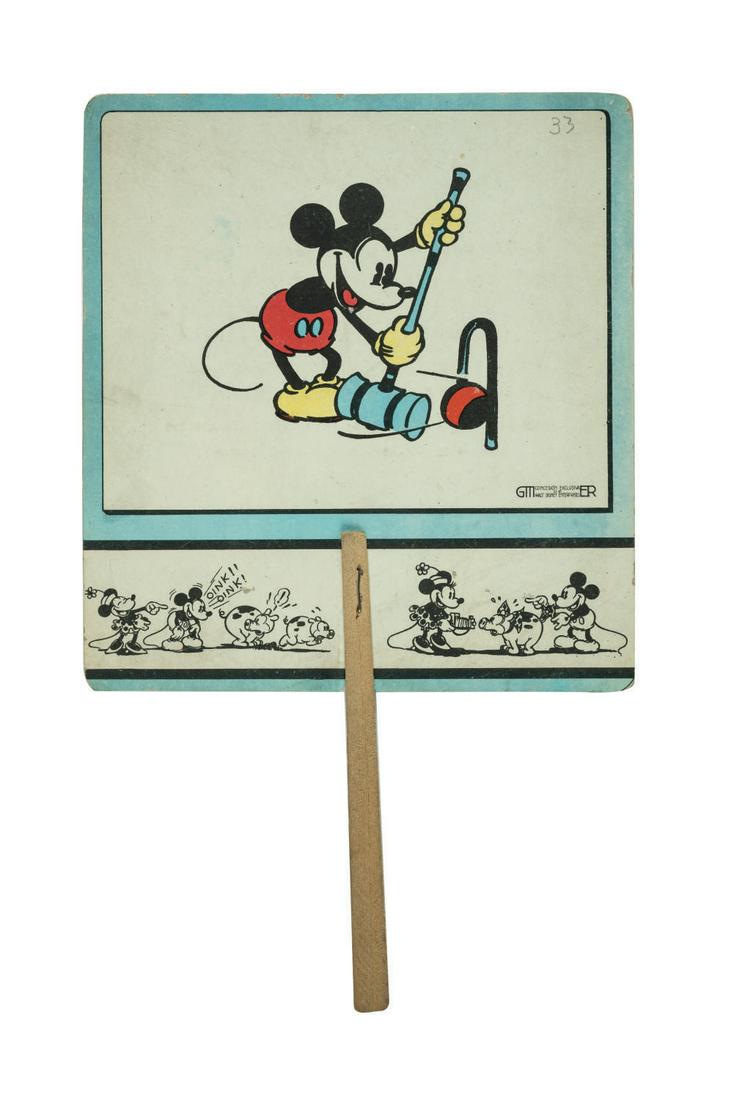 A Mickey Mouse Promotional Paper Fan.: (Disney, 1930s) A promotional paper fan featuring images of Mickey and Minnie Mouse. The text on the reverse identifies this as a giveaway from a shoe manufacturer and/or store in Barcelona, Spain. Me