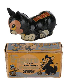 A Figaro Wind-Up Tin Toy with box.: (Marx, 1939) A Figaro wind-up tin litho toy by Marx. When wound, Figaro scampers forward as his tail flips and turns him in a new direction. The 3"x5" toy is in very good working condition with light