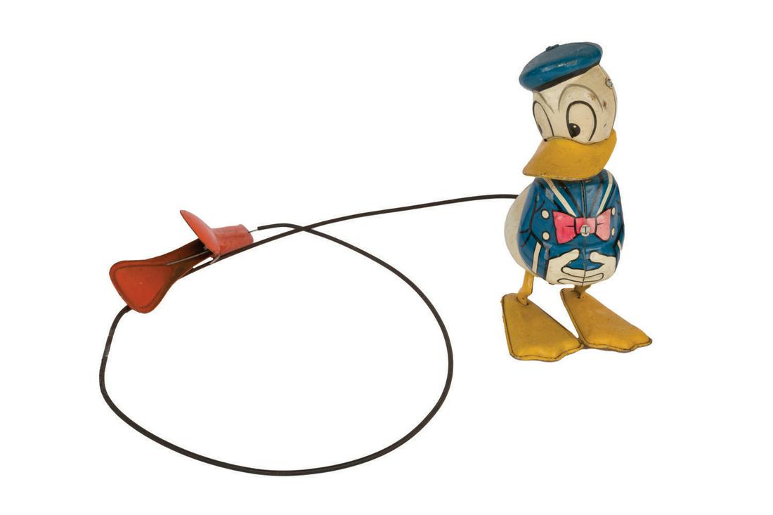 A Donald Duck Hopping Tin Toy. (1 of 2)