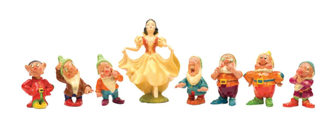 A Rare Wade Snow White & the Seven Dwarfs Ceramic Set.: (Wade, 1938) An extremely rare set of painted glazed ceramic figurines featuring Snow WhIte and the Seven Dwarfs. Produced by Wade of England, Snow White stands 6.5" tall and the dwarfs range between