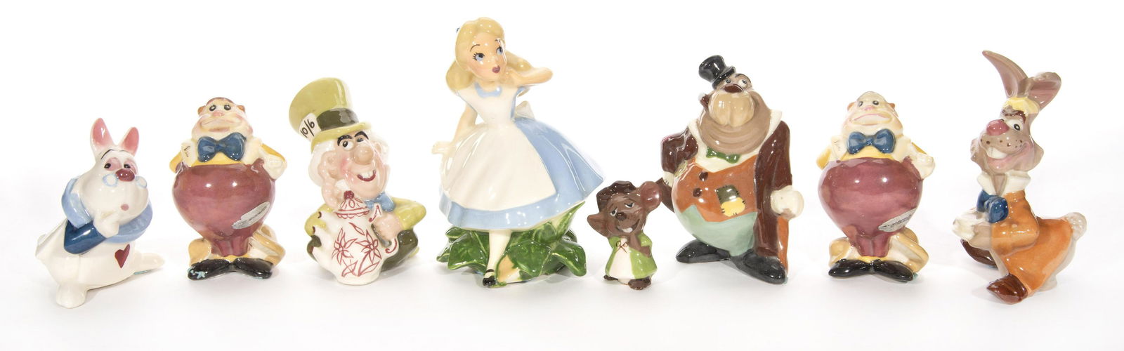 A Collection of Alice in Wonderland Ceramic Figurines. (1 of 9)