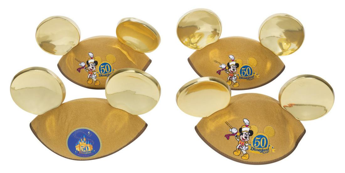A Collection of (4) Disneyland Golden Ears Hats.: (Disneyland, 2005) A collection of (4) Disneyland Golden Ears Hats produced in honor of the 50th anniversary of Disneyland Resort. This lot includes (3) Mickey Ear Hats with a Mickey Mouse patch and (