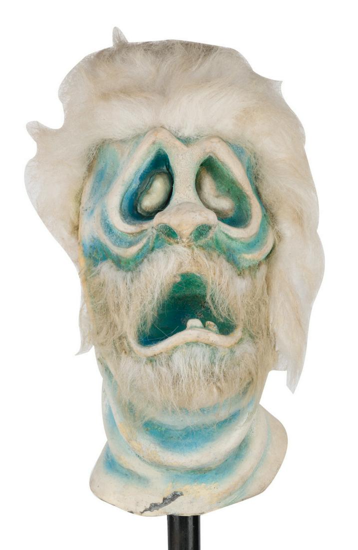 A Haunted Mansion Pop-Up Ghoul Head. (1 of 4)