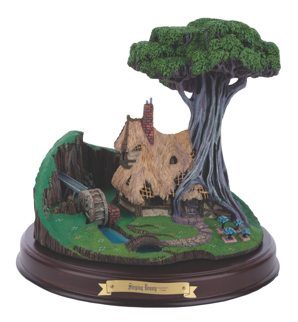 A WDCC Enchanted Sleeping Beauty Woodcutter's Cottage. (1 of 2)