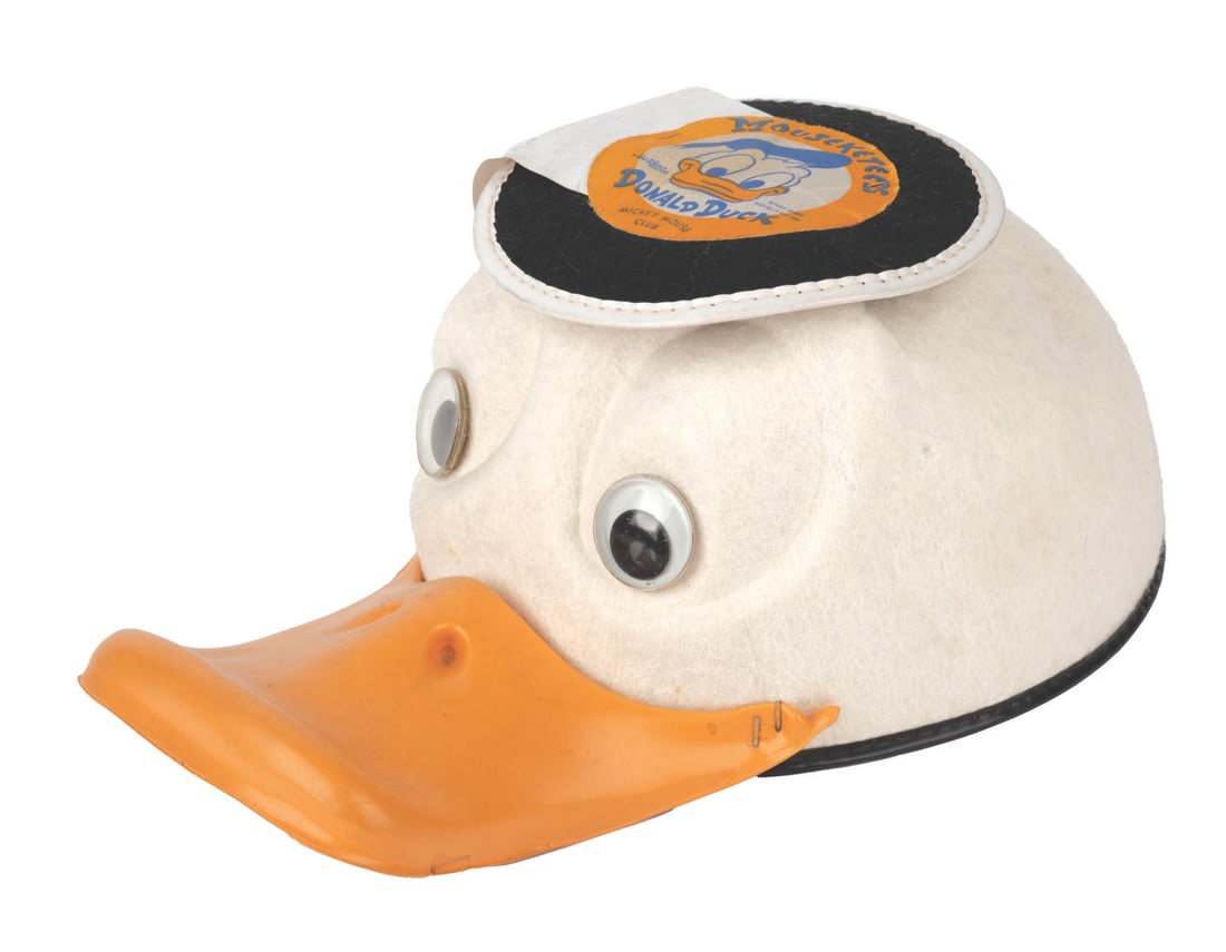 A Disneyland Souvenir Donald Duck Mouseketeers Hat.: (Disney, 1950s-60s) An early Mickey Mouse Club Donald Duck child's hat with a working squeaker in its bill, manufactured by Benay-Albee. Measuring a size "small," this vintage hat retains its original