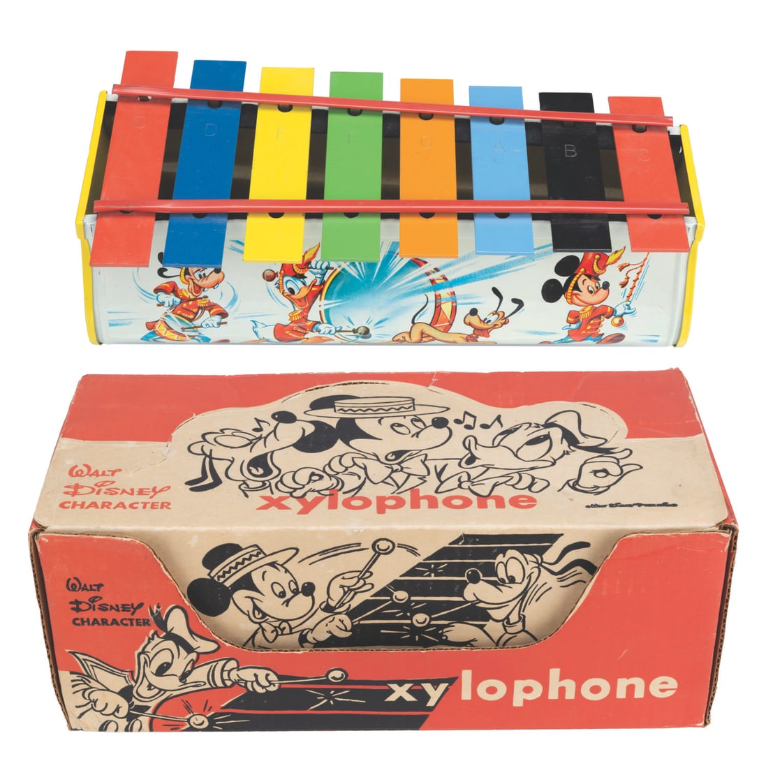 A Disney Character Xylophone.: (Tudor, 1959) A Disney Character Xylophone with its original box. Measuring 12.5"x6"x4.5", the toy is in very good condition with minor scuffs and wear and missing its mallets and song book. The 13"x6