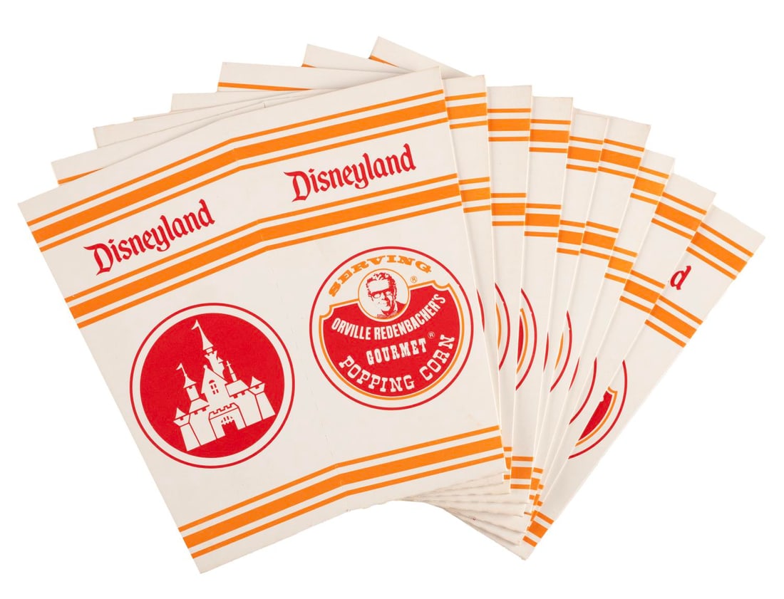 A Set of Disneyland Orville Redenbacher Popcorn Boxes.: (Orville Redenbacher, 1977-80s) A set of 25 unused popcorn boxes featuring Orville Redenbacher, the official popcorn of Disneyland from 1977 until 2015. Each measuring 7" x 6.75", the boxes are in fin