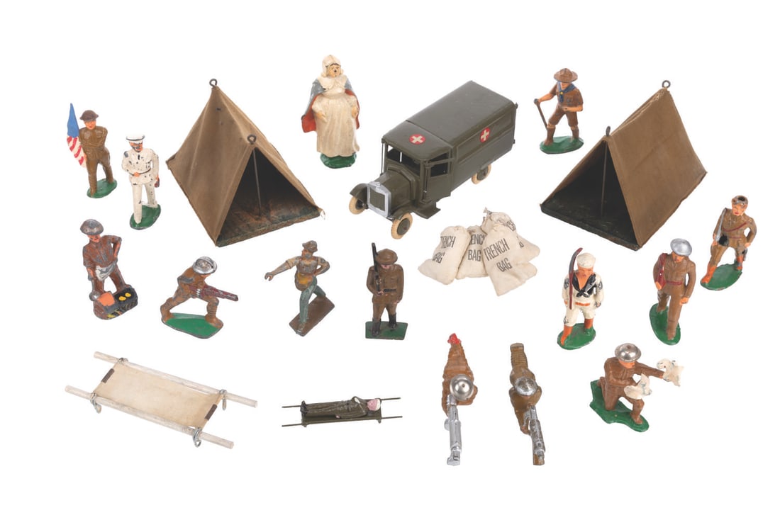 A Collection of Toy Soldiers and an Ambulance.: (Manoil, 1930s-1940s) A collection of toy soldiers and an ambulance. The collection includes thirteen soldiers, one nurse, four trench bags, two tents, and an ambulance with a wounded soldier inside.