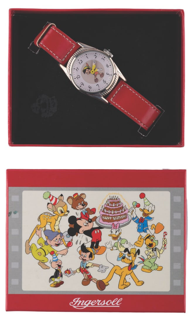 An Ingersoll Pinocchio Watch in Box.: (Ingersoll, 2000) A limited edition Pinocchio Ingersoll character wristwatch. This is a recreation of a 1948 watch by Timex and is numbered 0086 of 2000. Measuring 1” in diameter and 8.5”