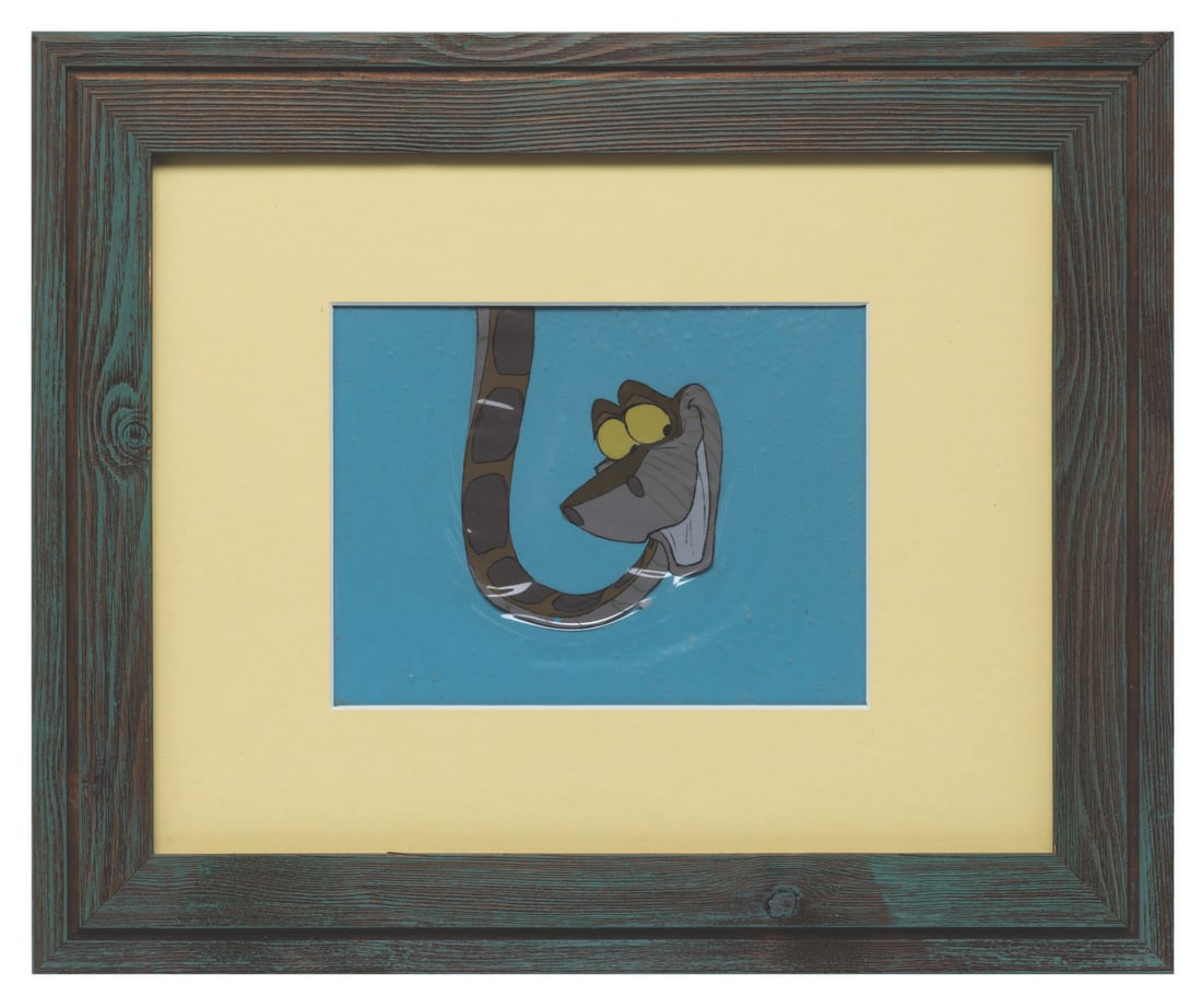 A Kaa Production Cel from "The Jungle Book.": (Disney, 1967) An original production cel of Kaa from "The Jungle Book." With an image size of 4" x 5", in a 6" x 8" matte, the cel is in good condition with a small paint chip at the bottom of the im