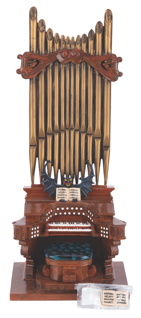 A Haunted Mansion Pipe Organ Sculpture with Pin.: (Walt Disney World, 2004) A limited edition resin figure of the iconic organ from the Haunted Mansion featuring a hidden compartment revealing a pin of the organ’s sheet music. This figure was offer
