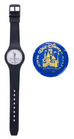A Tokyo Disneyland Magic Kingdom Club Watch and Button.