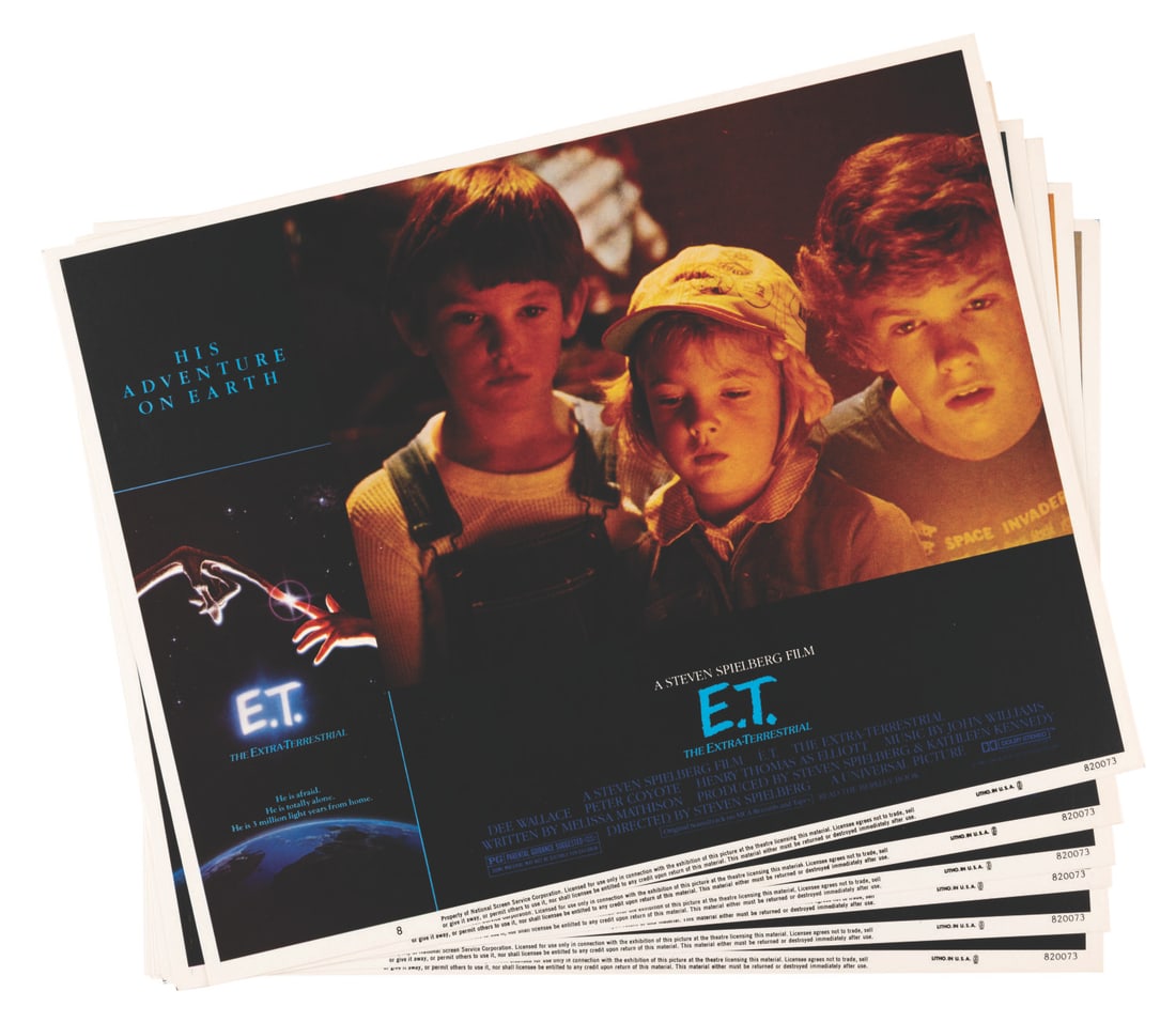 A Set of “E.T. the Extra-Terrestrial" Lobby Cards.: (Universal, 1982) A complete set of eight lobby cards from the Steven Spielberg classic “E.T. the Extra-Terrestrial.” Among the set are scenes featuring Henry Thomas as Elliot, a young Drew Ba