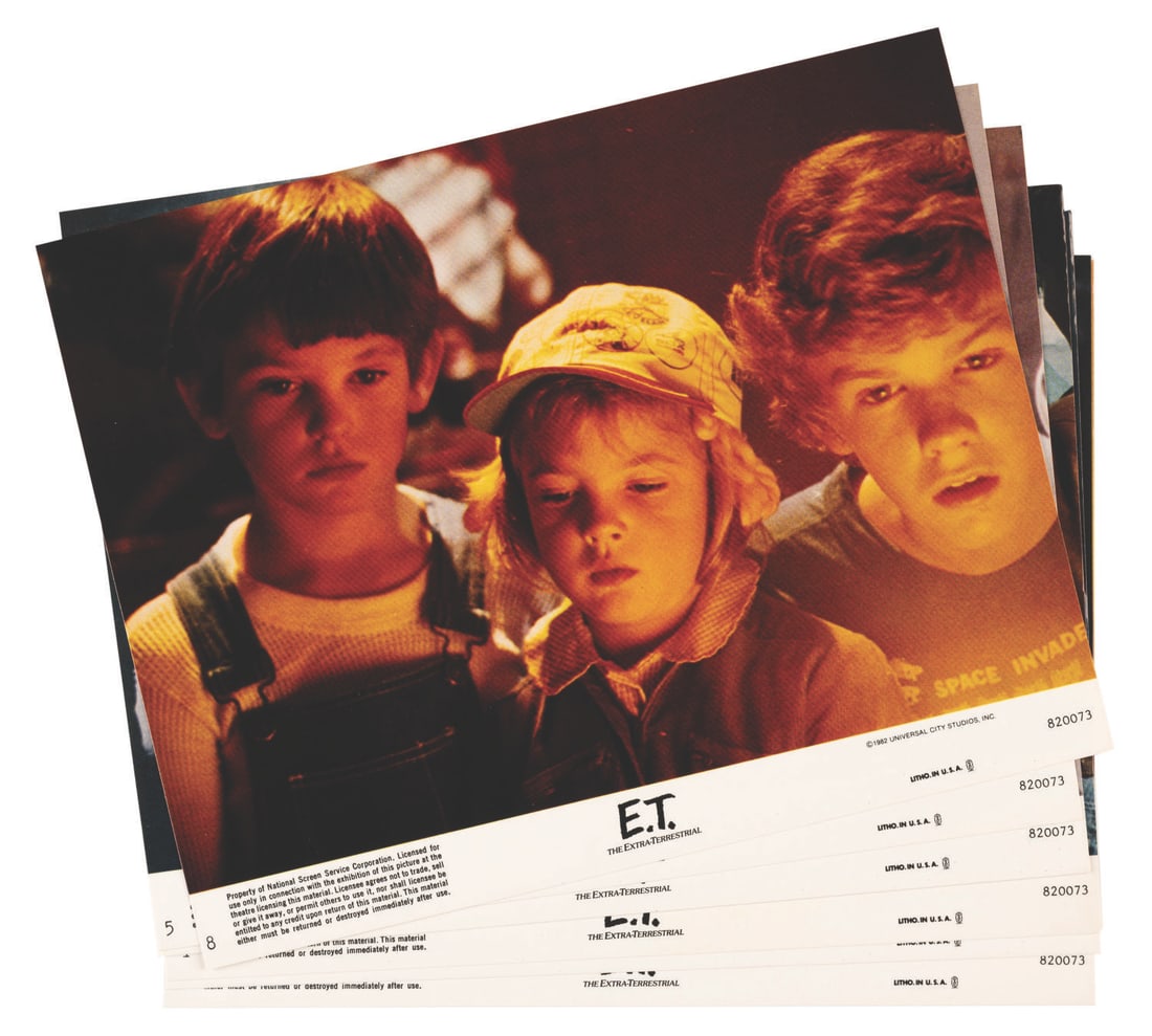 A Set of “E.T. the Extra-Terrestrial" Lobby Cards.: (Universal, 1982) A set of eight lobby cards for Steven Spielberg’s box-office hit “E.T. The Extra-Terrestrial.” Among the set are scenes featuring Henry Thomas as Elliot, a young Drew Barry