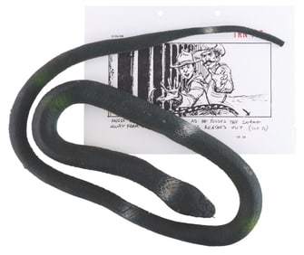 A "The Last Crusade" Prop Snake and Storyboard Page.