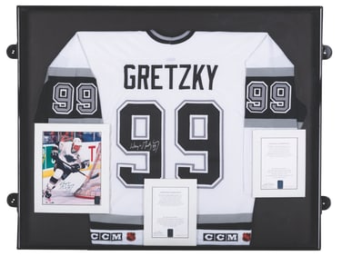 A Wayne Gretzky Signed Jersey and Photo.